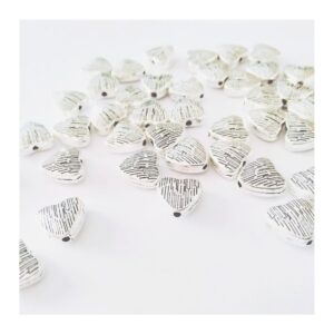 20 dijes corazones pasantes  0,8 cm x 0,7cm